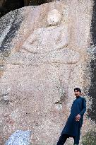 Buddha carving partially destroyed by militants restored in Pakistan