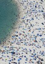 Crowded beach in sizzling Japan