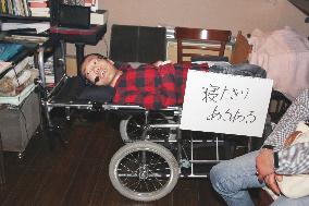 CORRECTED: Japan's only "bedridden" comedian laughs in face of adversity