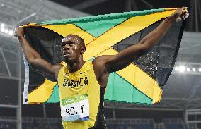 Olympics: Bolt completes 3rd sprint double with 200 win