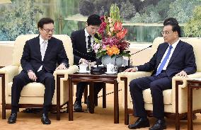 Chinese premier meets Japanese PM's key aide