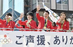 Olympics, Paralympics medalists parade through Tokyo