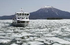 Sightseeing boat on icy Lake Akan in Hokkaido