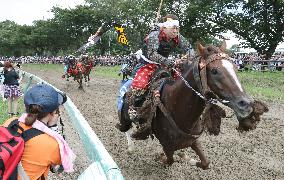 Armored warriors compete in horse race