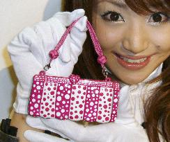 KDDI unveils new mobile phone brand in tie-up with designers