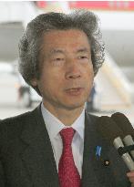 Koizumi vows to pick up abductees' kin, eyes cooperative ties