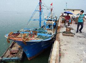 Chinese fishing boat returns home after collision