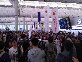 Thousands protest at H.K. airport over aviation security scandal
