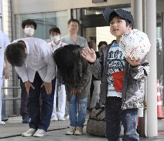 Japanese boy who survived alone in forest leaves hospital
