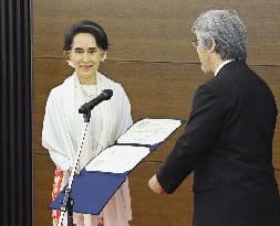 Suu Kyi receives honorary doctorate from Kyoto University
