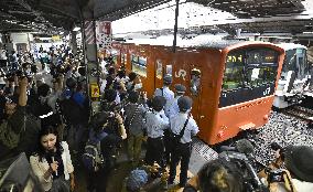 Osaka's iconic orange train makes final run