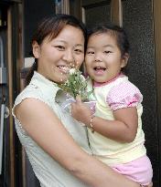 Japanese girl taken hostage in Cambodia arrives with family in J