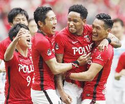 Reds edge Sapporo to maintain lead in J-League