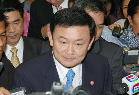 Thai premier Thaksin rebuffs resignation call after election