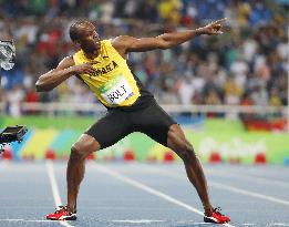 Olympics: Bolt completes 3rd sprint double with 200 win