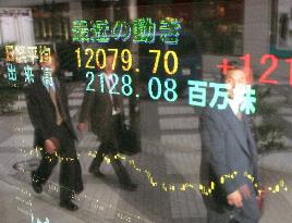 Stocks rise, Nikkei hits 32-month closing high above 12,000