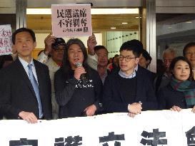 4 pro-democracy H.K. lawmakers fight disqualification trial