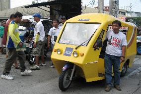 E-tricycles ply streets in Philippines