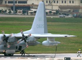 U.S. Marine plane drags fuel hose on runway in landing in Okinaw