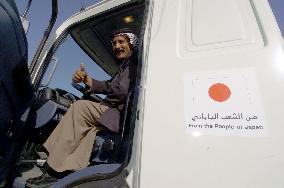 (2)Japan provides Iraq with water trucks