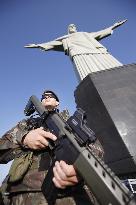 Olympic scenes: Guard at Christ the Redeemer statue