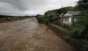 River flooding reported as heavy rain hits southwestern Japan