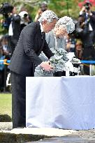 Emperor, empress lay flowers for Japanese WWII dead in Philippines