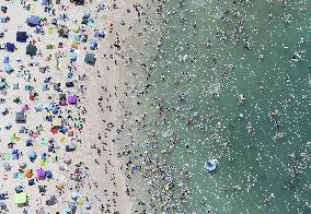 Crowded beach in sizzling Japan