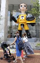 Child statue in protective suit in crisis-hit Fukushima