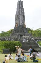 Slogan used in WWWII carved on stone tower in Kyushu