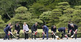 G-7 leaders plant trees at Shinto shrine