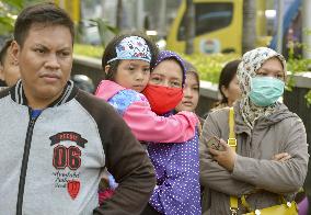 Jakarta in aftermath of gun and bomb attack