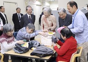 Emperor and empress visit facility for disabled