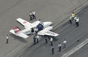 Small plane collapses on landing at Nagasaki airport