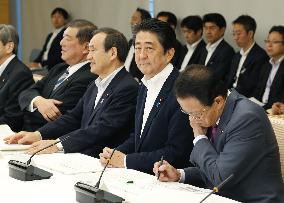Japan retains economic assessment despite corporate profit downgrade