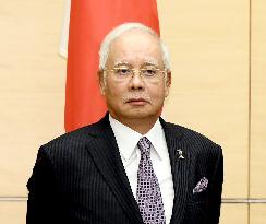 Former Malaysia PM Najib banned from leaving country