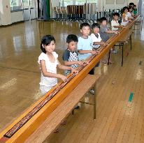 Primary school students make world's longest 'soroban'