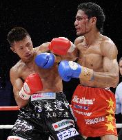 Uchiyama defends super featherweight title