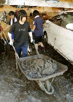 High school students volunteer to clean typhoon-hit homes