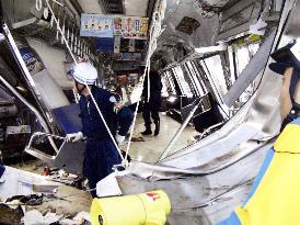 (5)At least 10 still inside derailed train's 1st car