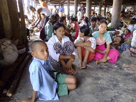 Survivors of killer cyclone take refuge in monastery in Myanmar