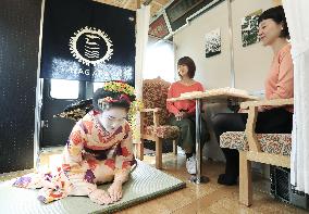 Geisha performance in local train car