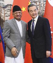 Foreign Minister Wang of China and counterpart Gyawali of Nepal