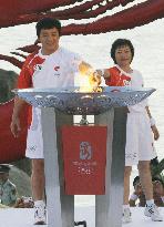 Jackie Chen joins Beijing Olympic torch run in Hainan