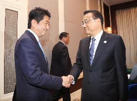 Abe conveys stance on maritime rows to Chinese premier