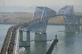 Running across Tokyo Gate Bridge