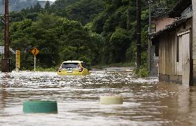 Torrential rain triggers massive flooding in southwestern Japan