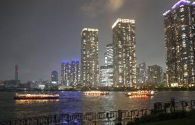 Boats in Tokyo harbor light up to create hope amid virus pandemic