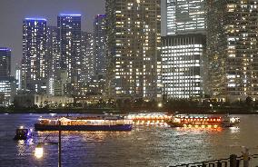 Boats in Tokyo harbor light up to create hope amid virus pandemic