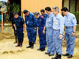 Japan PM Abe visits flood-hit southwestern Japan